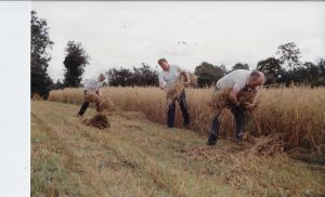 Tying of sheaves after the reaper. (l-r) Raymond McNamee, Willie Turner & Michael McNamee